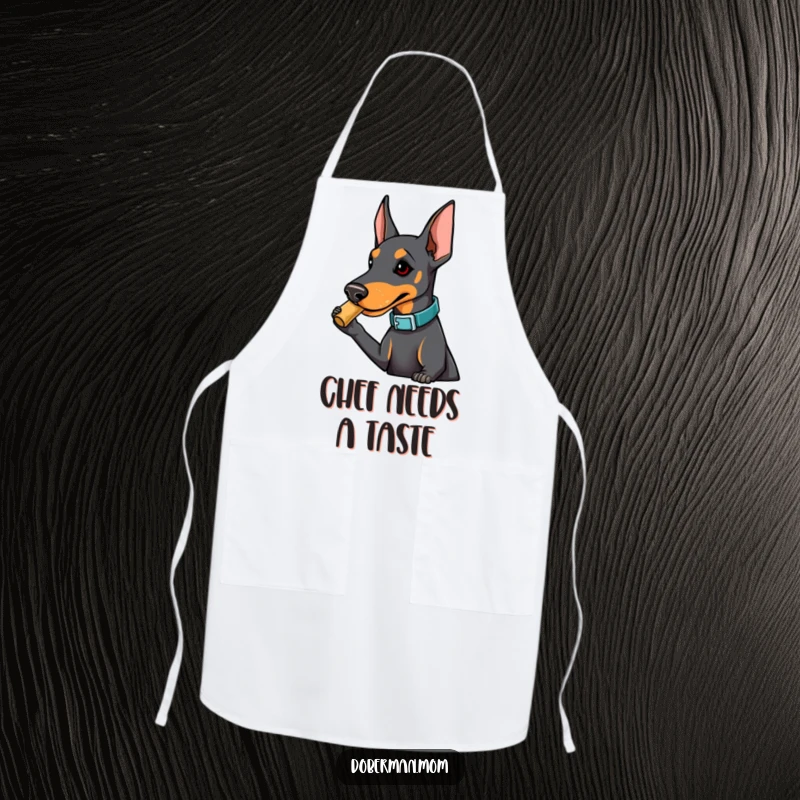 Funny Doberman apron with a dog in a fashionable collar playfully nudging a treat, adding playful humor and protection for cooking.