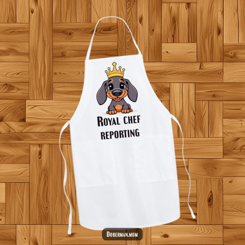 Funny Doberman Apron: A jolly Doberman dog wearing a tiny crown, looking regal and ready to oversee delicious creations.