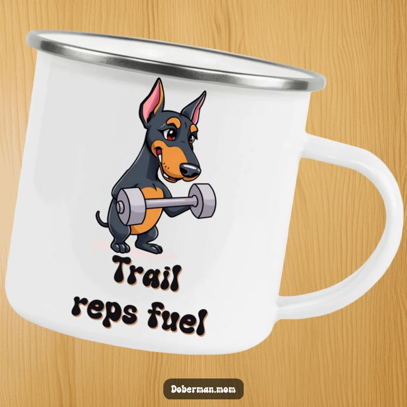 Funny Doberman camping mug depicting a determined dog balancing a small dumbbell, ideal for outdoor use.