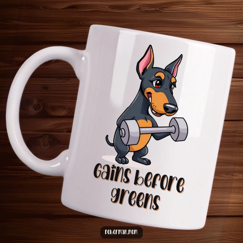 Funny Doberman mug showing a strong dog with a determined look, balancing a tiny dumbbell, ready for a workout.