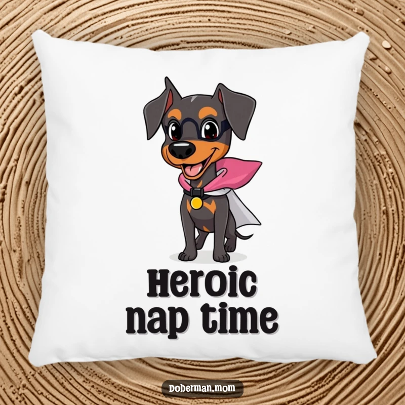 Funny Doberman pillow featuring a happy dog wearing a small superhero cape, ready for action and cozy moments.