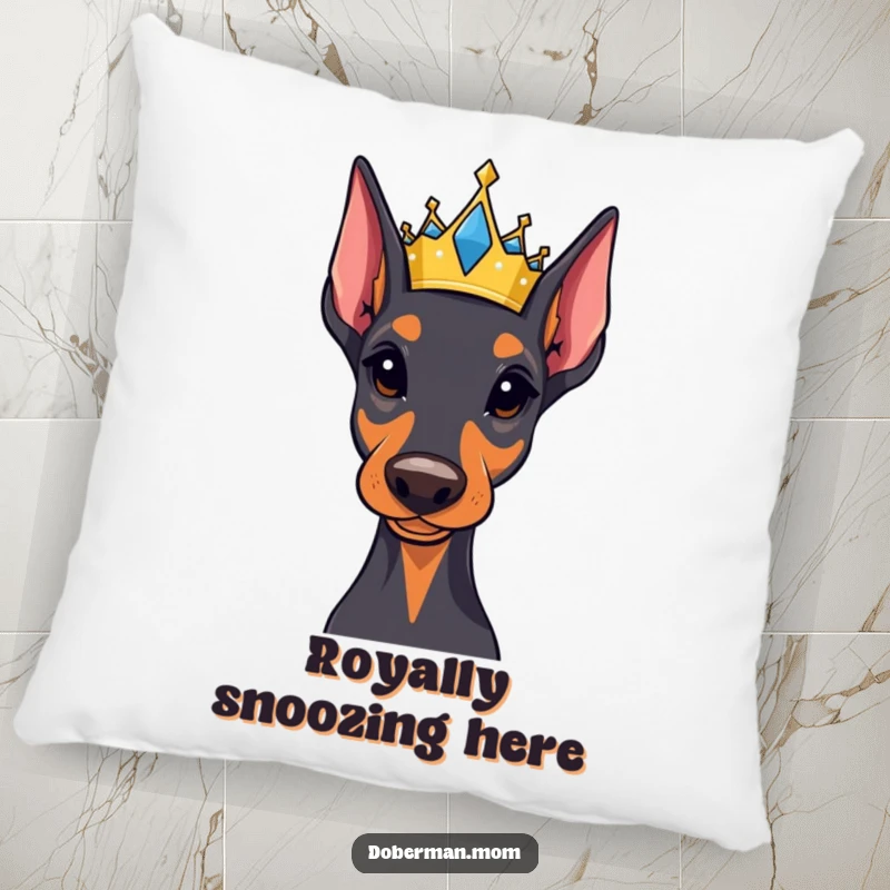 Funny Regal Doberman pillow featuring a small, jeweled crown, providing majestic comfort and a touch of humorous, regal decor.