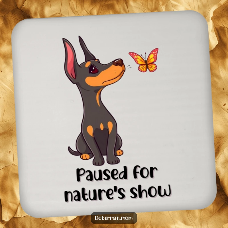 Funny Doberman coaster, depicting a dog's curious head tilt as it observes a nearby butterfly.