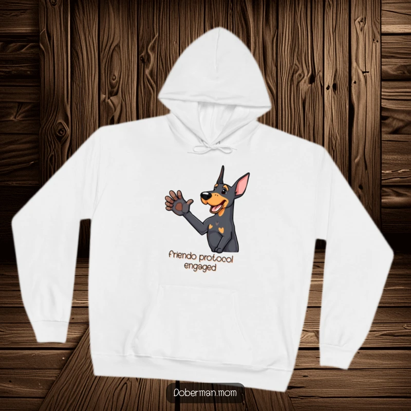 Funny Doberman hoodie featuring a delighted dog offering a friendly paw, perfect for staying warm with a humorous greeting.