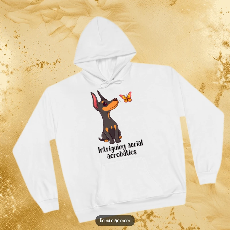 Funny Doberman hoodie, showing a dog's curious head tilt while observing a butterfly's aerial dance.