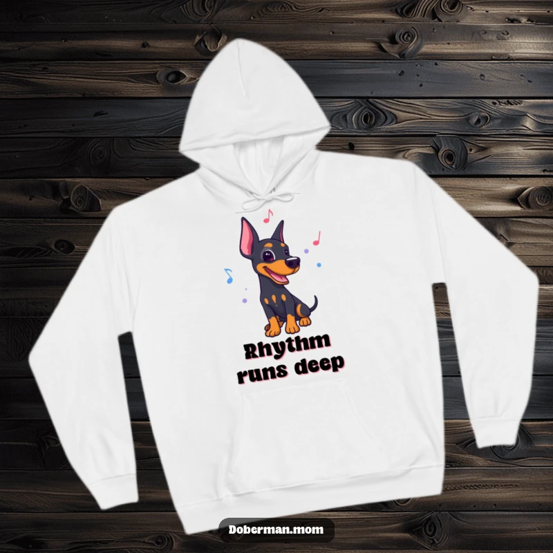 Funny Doberman hoodie, grooving to a lively rhythm with musical notes, perfect for cozy dancing.