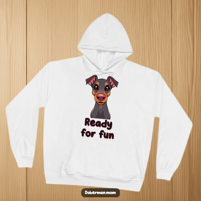 Funny Doberman hoodie with a playful glint in its eye and a wiggly nose, perfect for cozy fun and doggy charm.