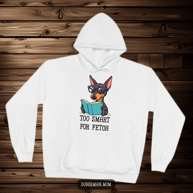 Funny Doberman Hoodie featuring a distinguished Doberman dog wearing reading glasses while engrossed in reading a thick book.