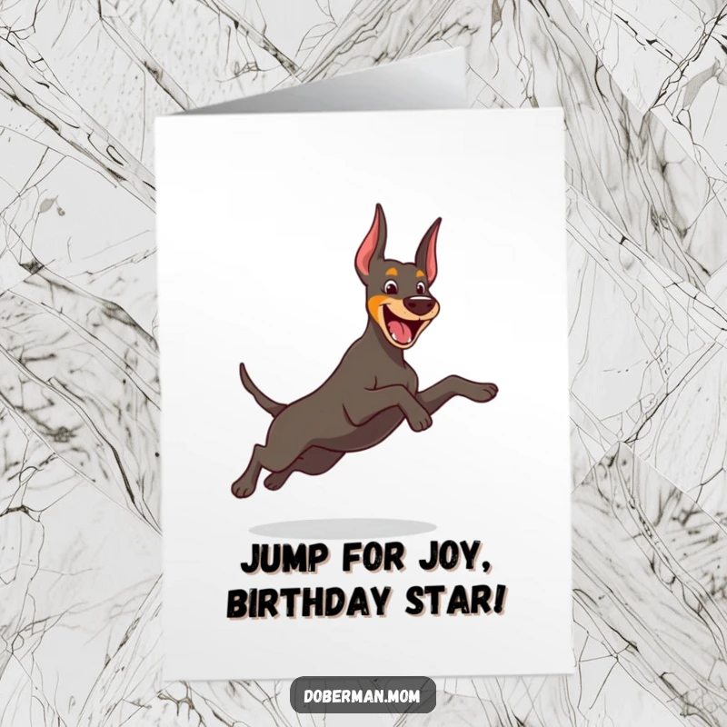 Funny Free Printable Birthday Card showing a cheerful Doberman dog in a graceful, playful leap, full of excitement and birthday wishes.