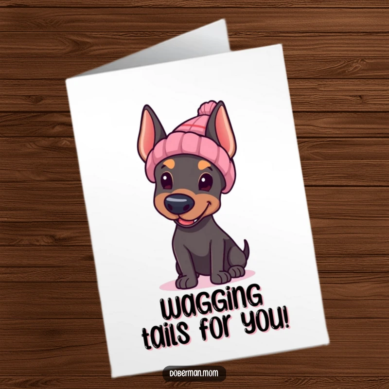Funny Free Printable congratulations card: A Doberman in a knitted hat offering a cheerful wave to celebrate success.