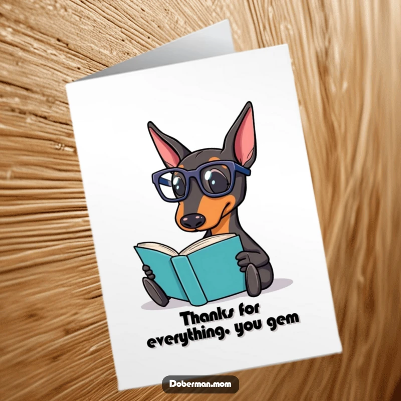 Funny Free Printable Thank You Card: Doberman wearing reading glasses, holding a book, looking grateful and intelligent.