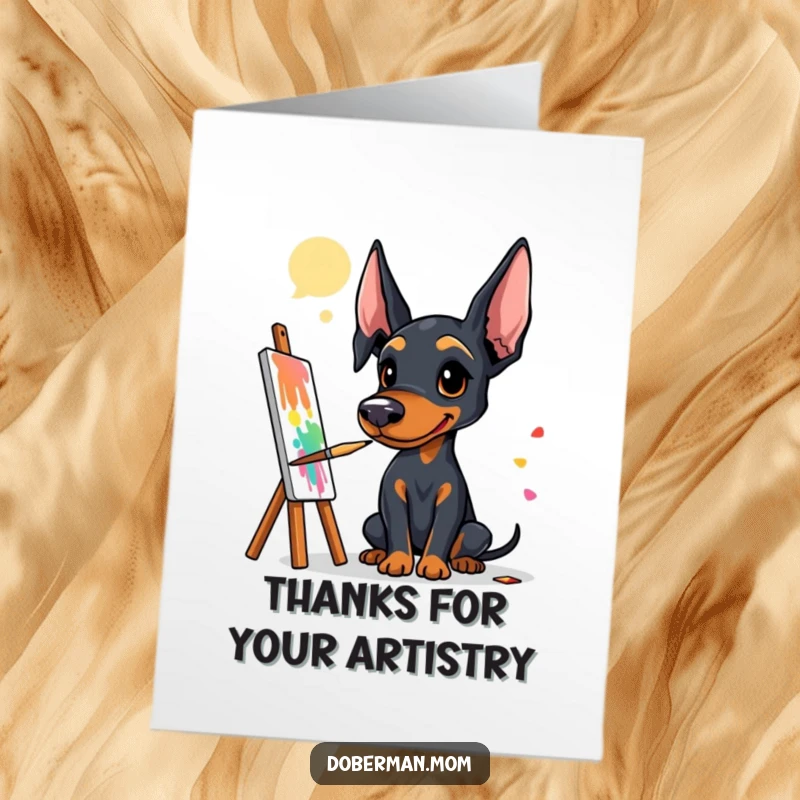 Funny Free Printable Thank You Card: Doberman artist beaming, brush in paw, surrounded by a beautiful, colorful creation.
