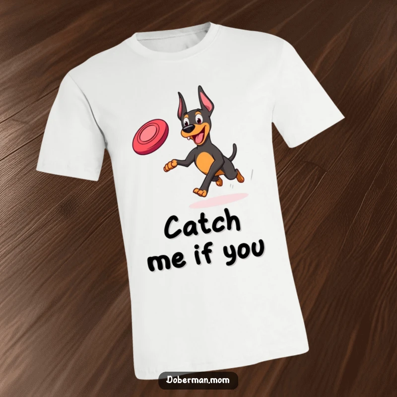 Funny Frisbee Doberman T-Shirt: A Doberman joyfully running, leaping with excitement for a frisbee.
