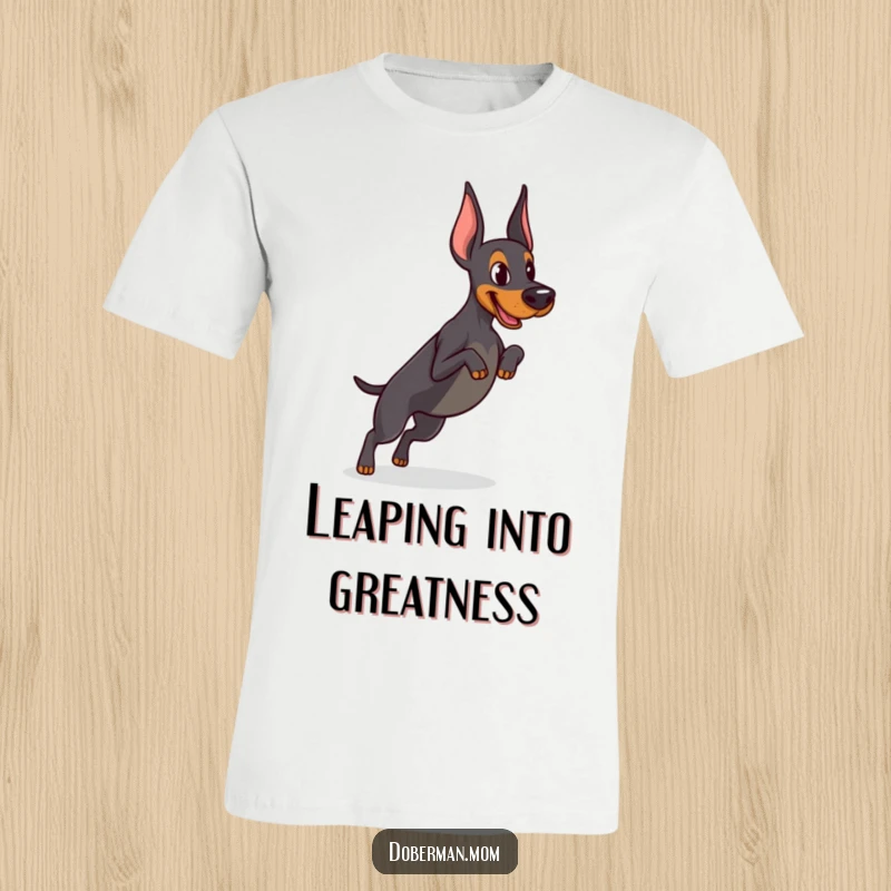 Funny Determined Doberman t-shirt showing focused practice of a tiny jump, embodying athletic spirit and humorous dedication to training.