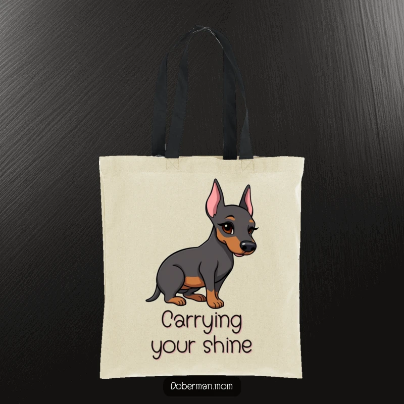 Funny Doberman tote bag showing a winking dog holding a shiny polished boot, perfect for everyday use.
