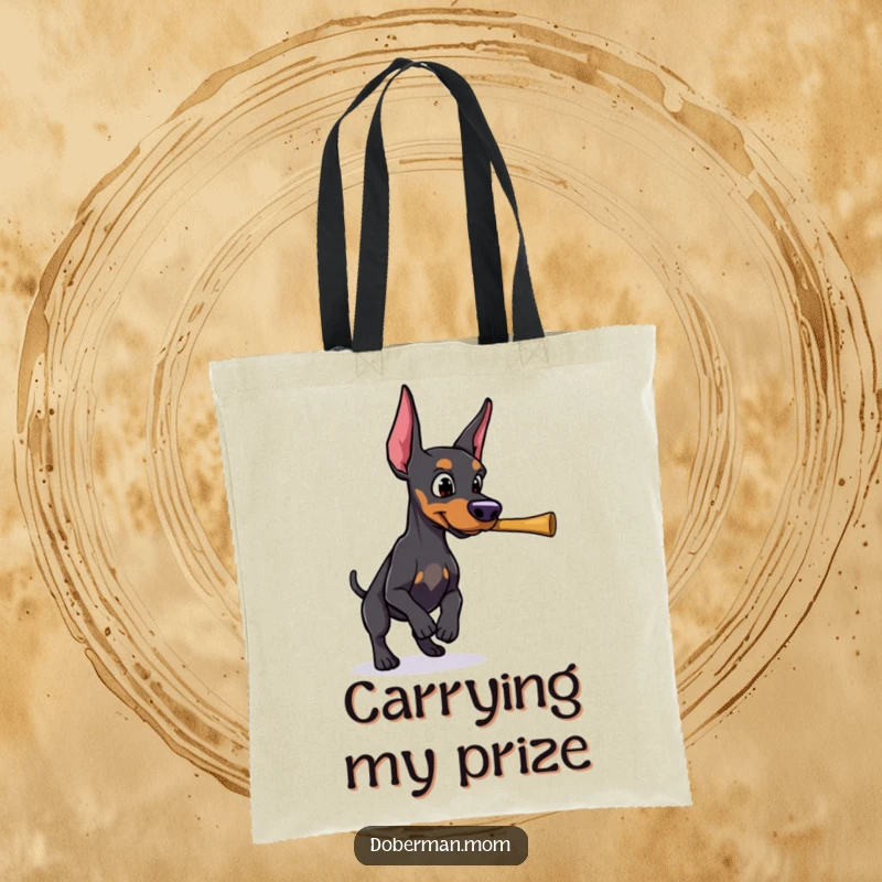 A determined Doberman in the act of retrieving a thrown stick is illustrated on this functional tote bag.