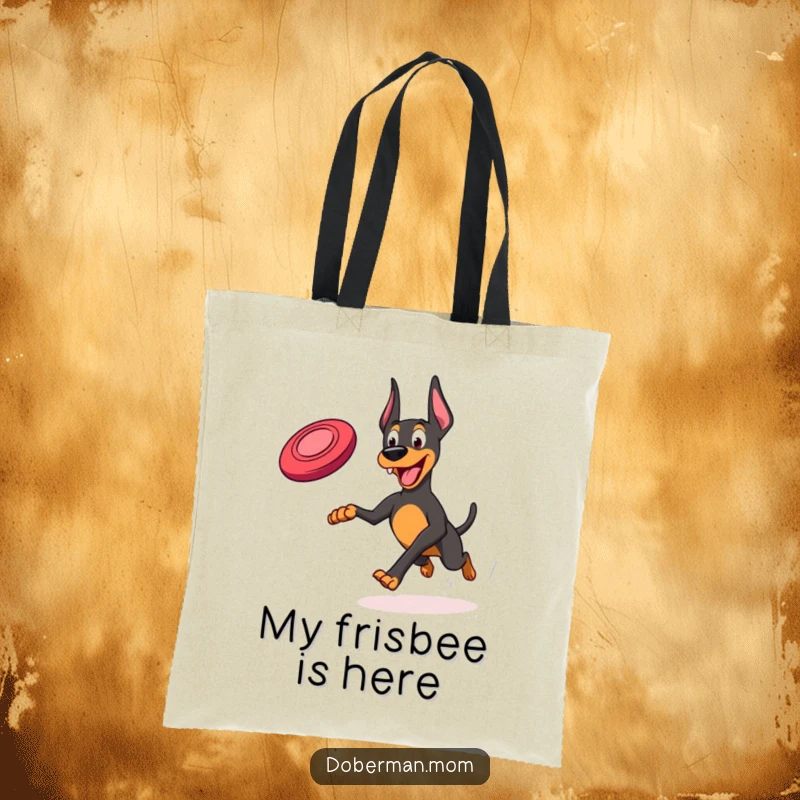 Funny Frisbee Doberman Tote Bag: A Doberman joyfully running with a frisbee, ready for park adventures.