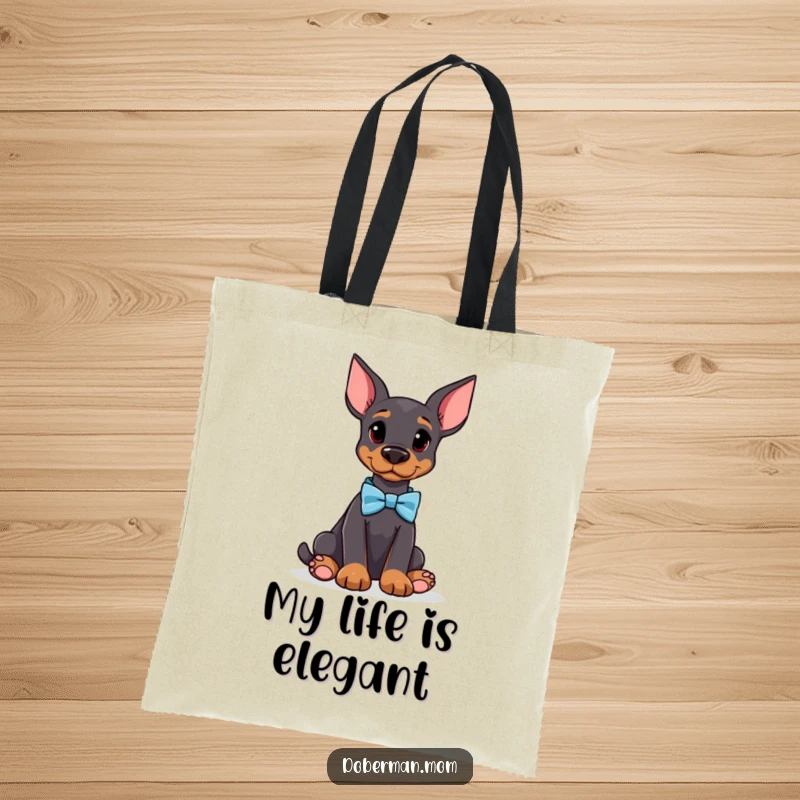 Funny Doberman tote bag with an attentive dog wearing a bow tie, offering a sophisticated and humorous way to carry your items.